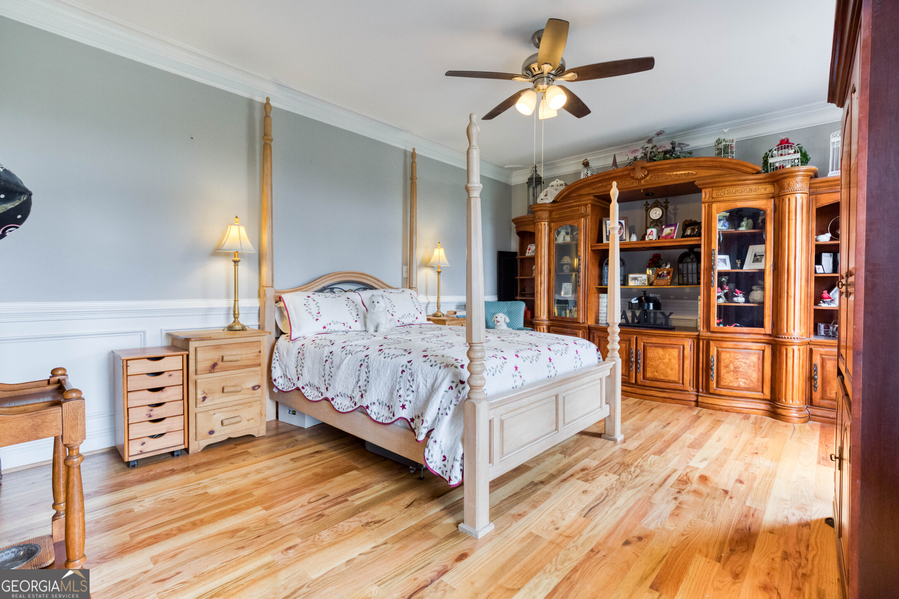 1811 Michael Road Northwest Monroe, GA 30656 - Photo 15 of 43 a bedroom with a large bed and a chandelier