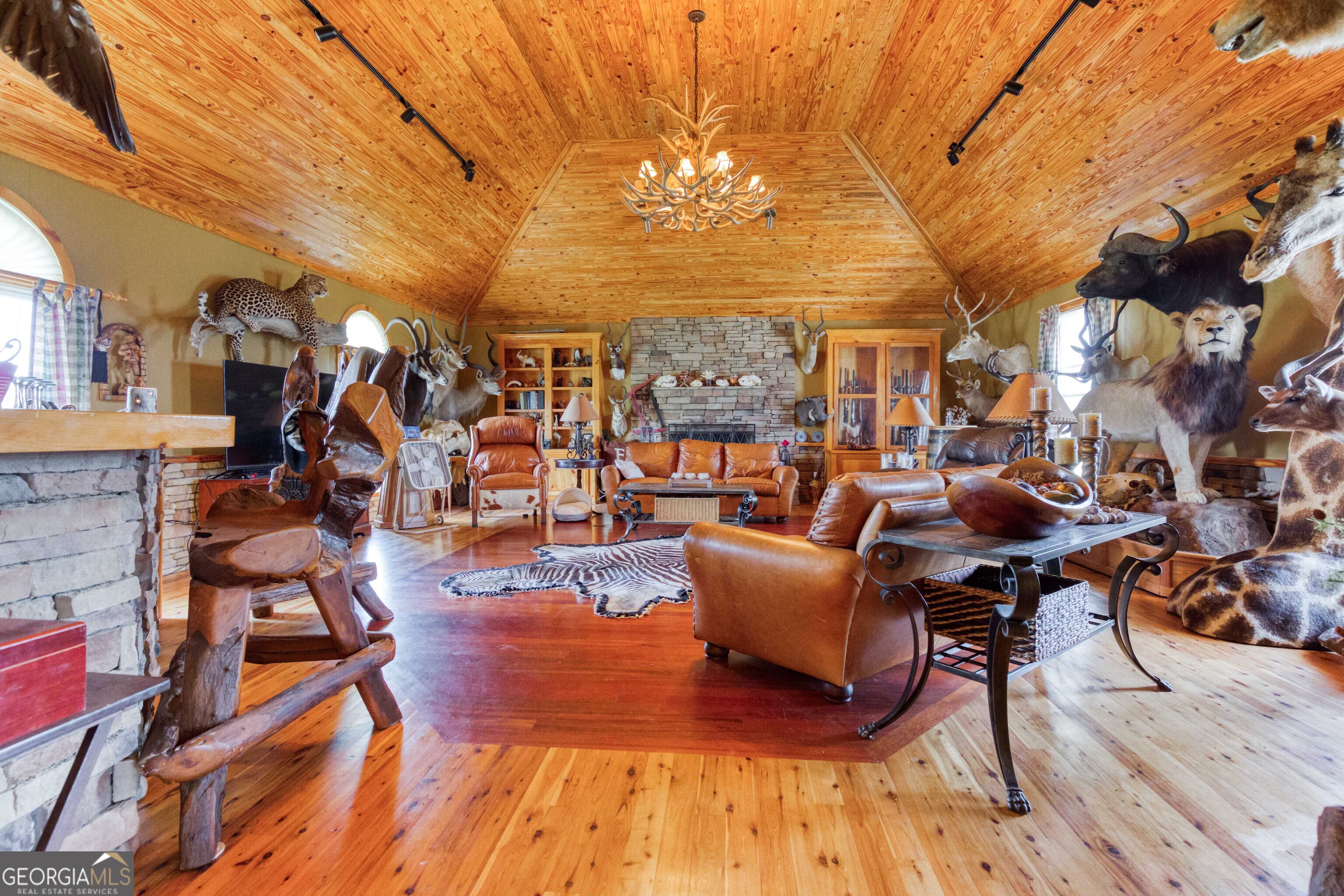 1811 Michael Road Northwest Monroe, GA 30656 - Photo 20 of 43 a view of a patio with dining table and chairs with wooden floor and fence