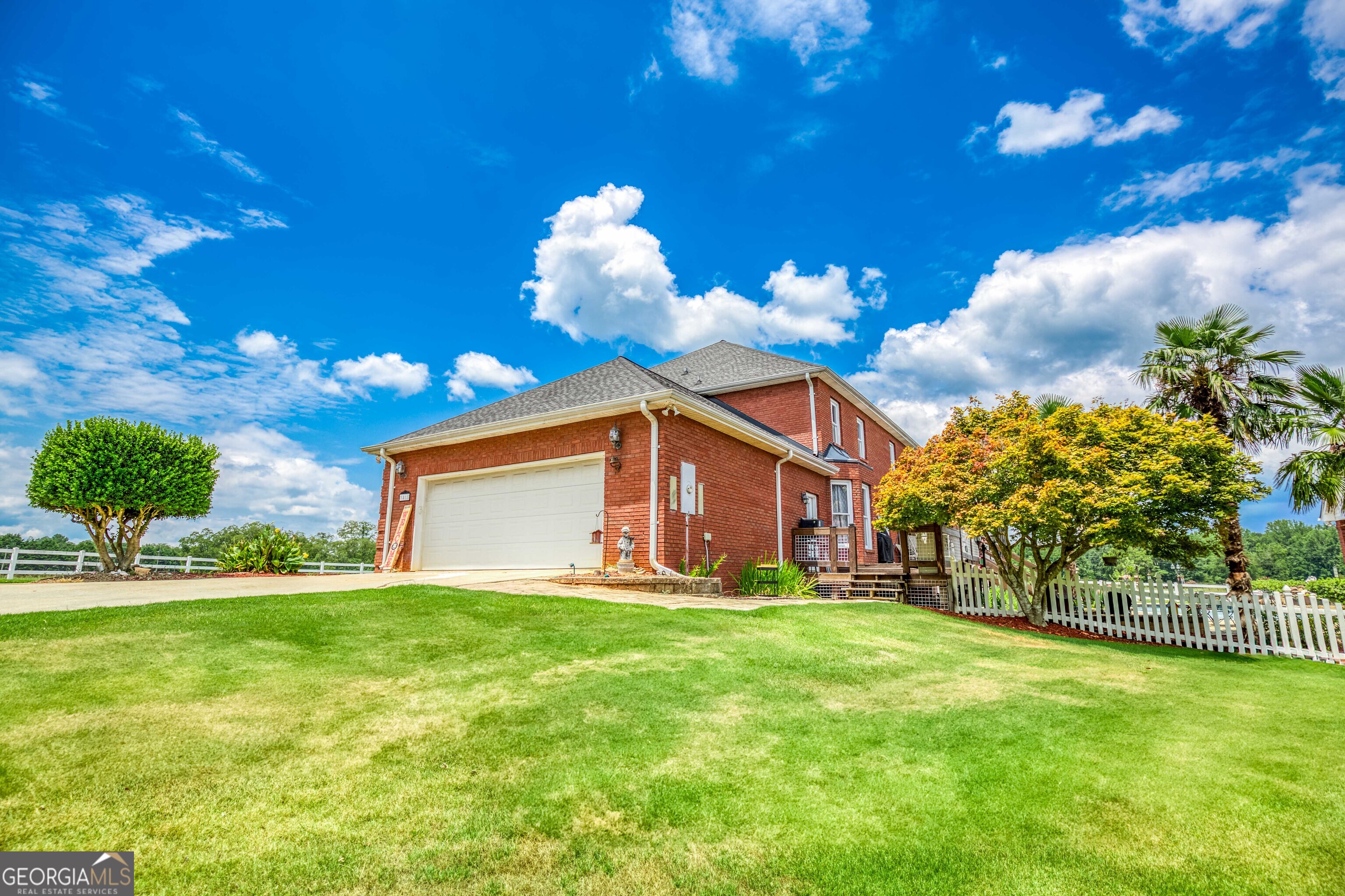 1811 Michael Road Northwest Monroe, GA 30656 - Photo 2 of 43 a front view of a house with a big yard