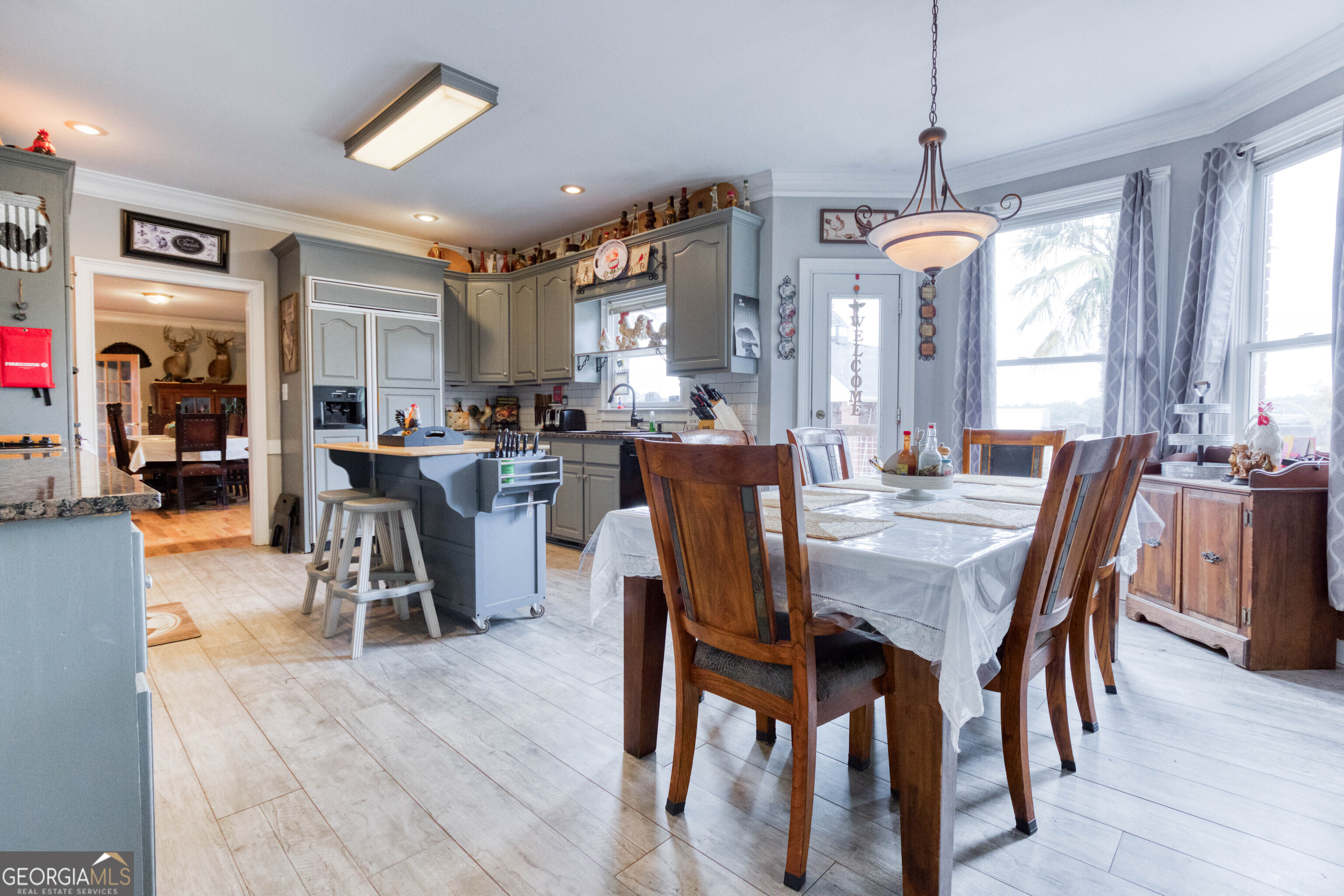 1811 Michael Road Northwest Monroe, GA 30656 - Photo 24 of 43 a view of a dining room with furniture window and wooden floor