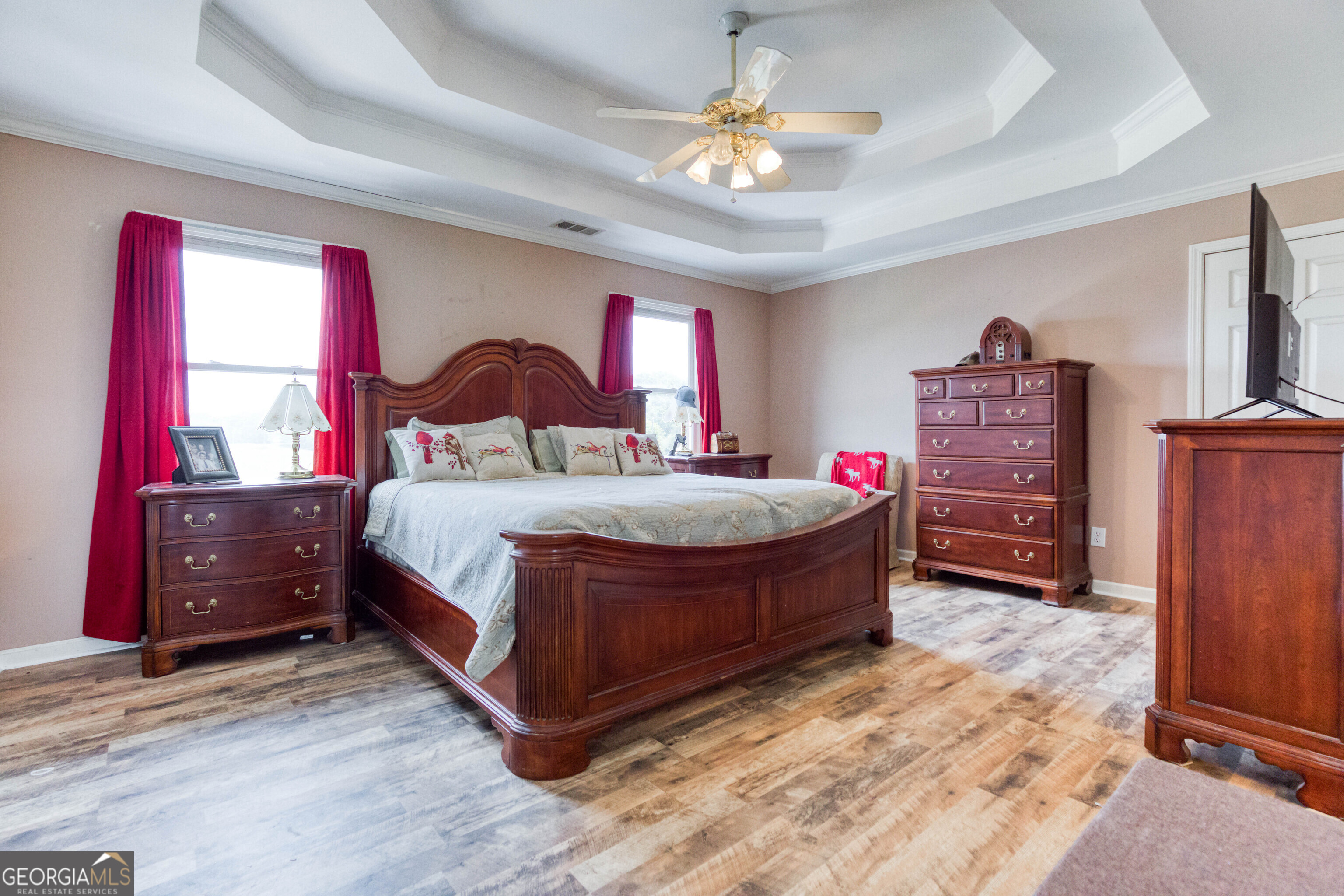 1811 Michael Road Northwest Monroe, GA 30656 - Photo 32 of 43 a bedroom with a bed and a chandelier