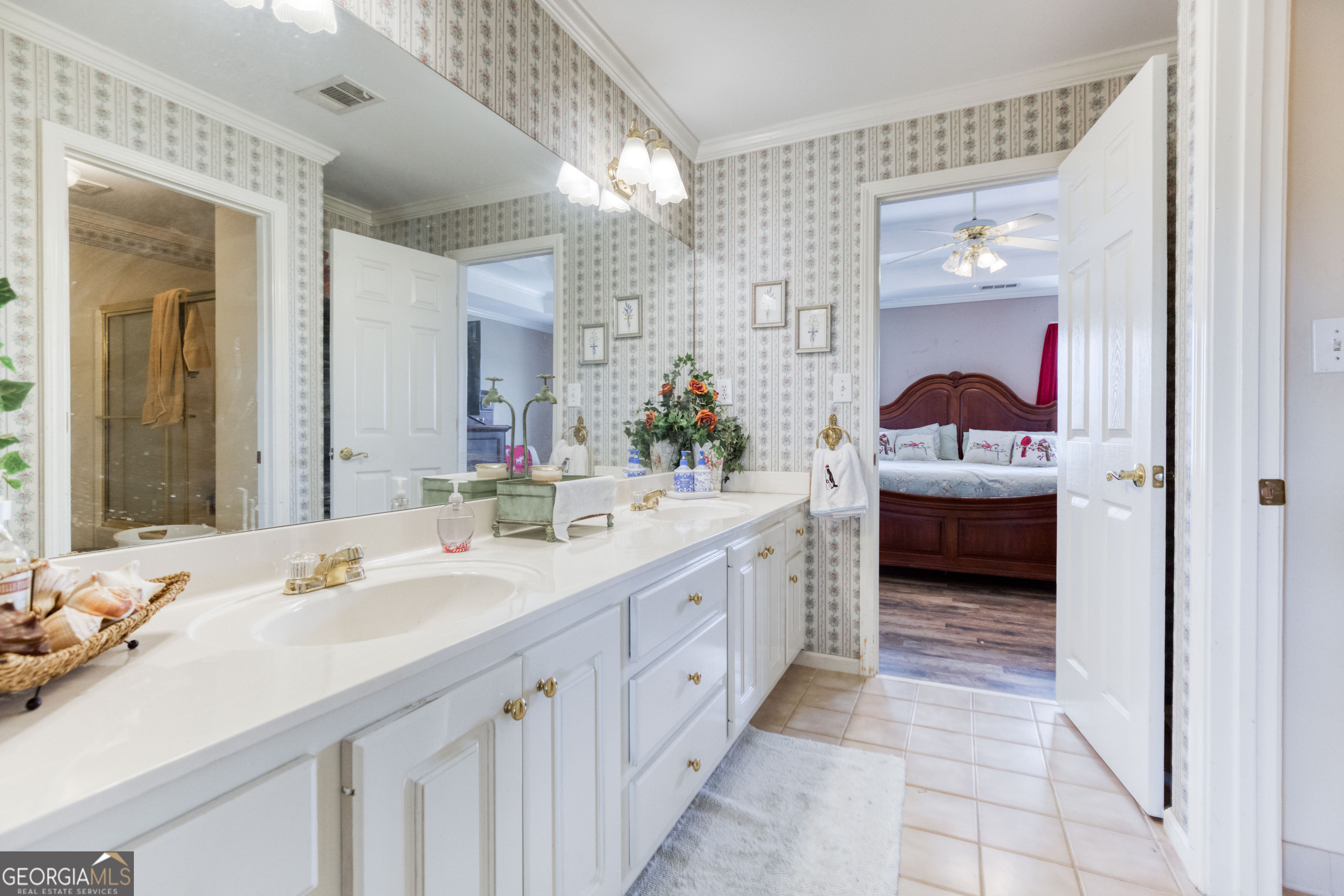 1811 Michael Road Northwest Monroe, GA 30656 - Photo 34 of 43 a en suite bathroom with a double vanity sink and a mirror