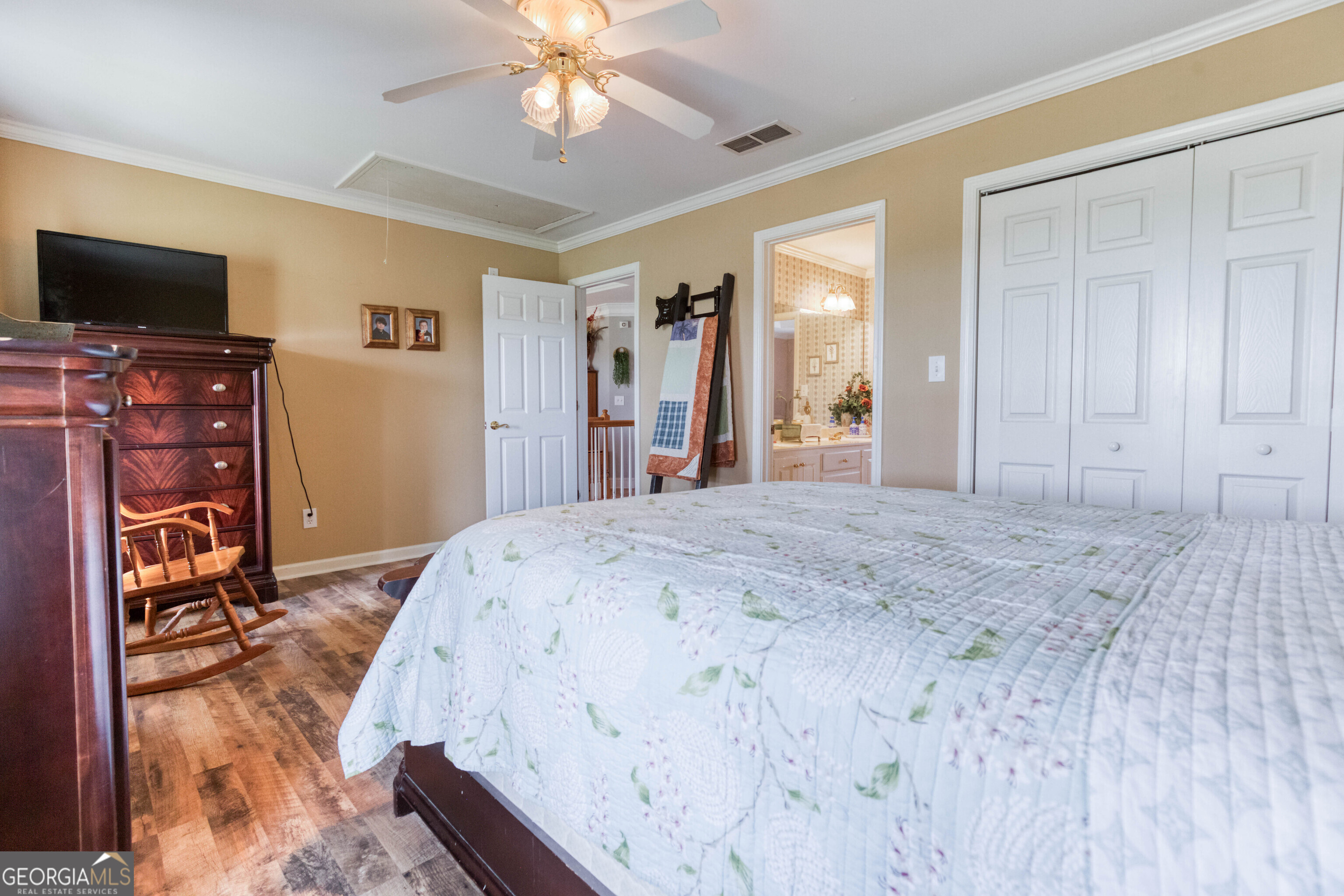 1811 Michael Road Northwest Monroe, GA 30656 - Photo 35 of 43 a bedroom with a bed and a flat screen tv