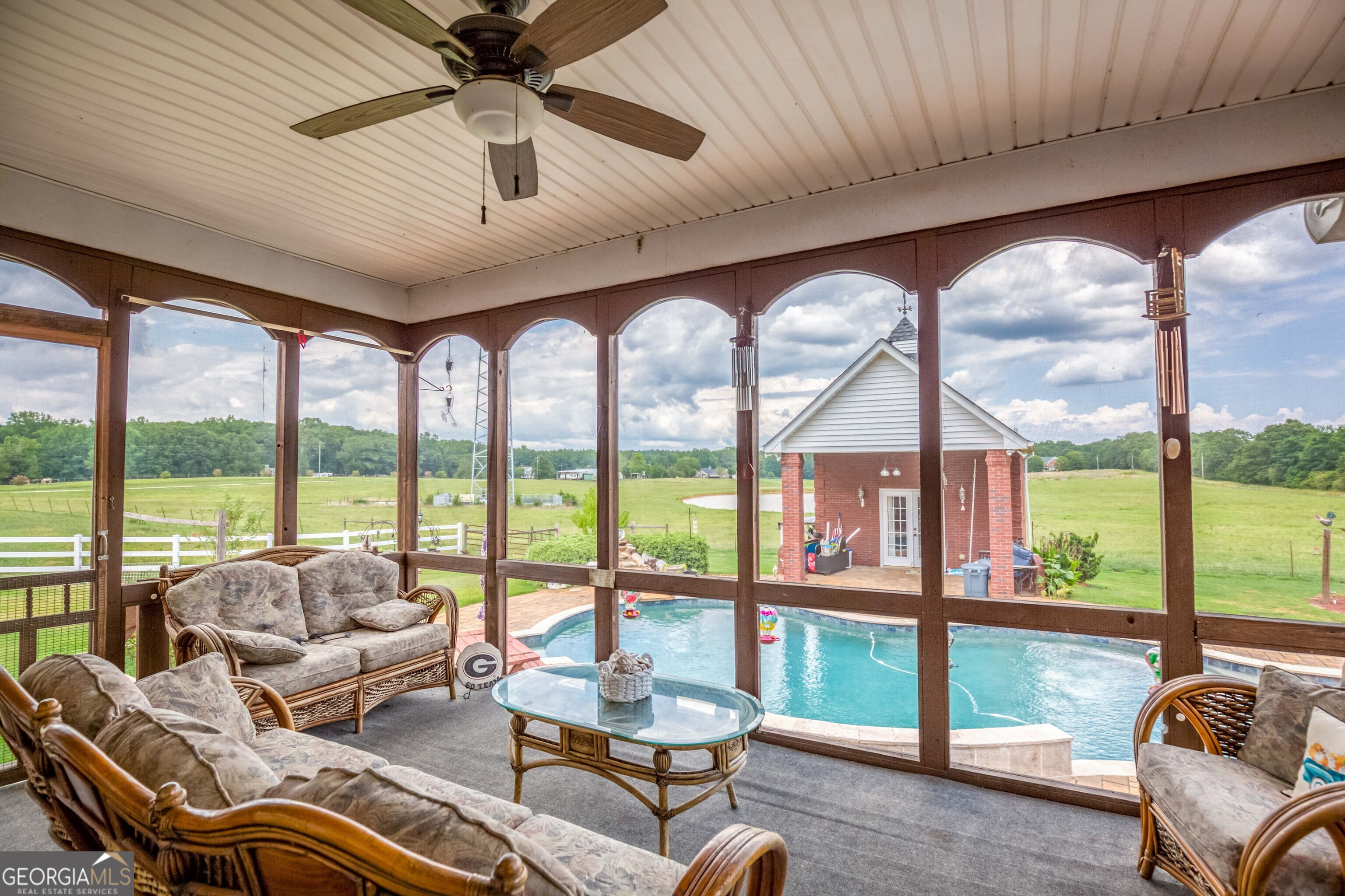 1811 Michael Road Northwest Monroe, GA 30656 - Photo 36 of 43 a living room with furniture and floor to ceiling windows