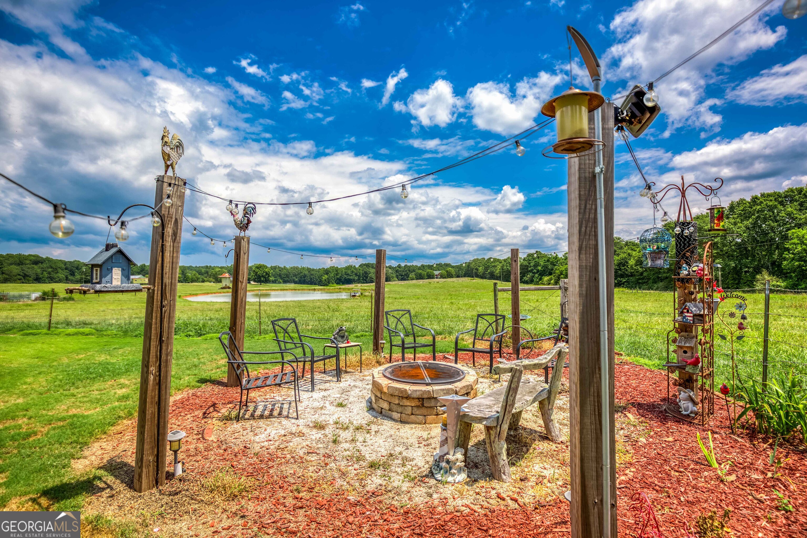 1811 Michael Road Northwest Monroe, GA 30656 - Photo 43 of 43 a view of a patio with a table chairs and a backyard