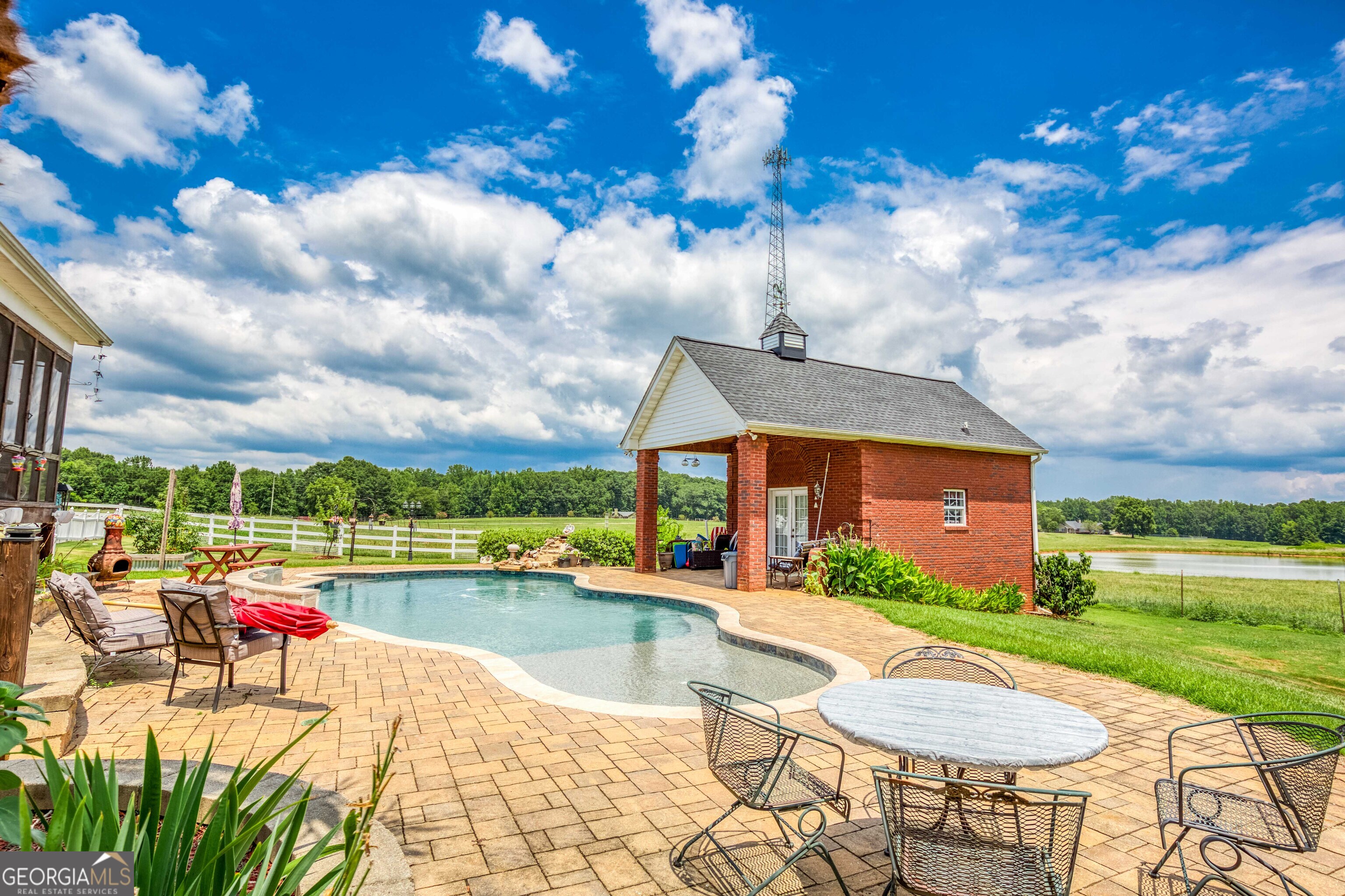 1811 Michael Road Northwest Monroe, GA 30656 - Photo 8 of 43 a view of a house with swimming pool and a yard
