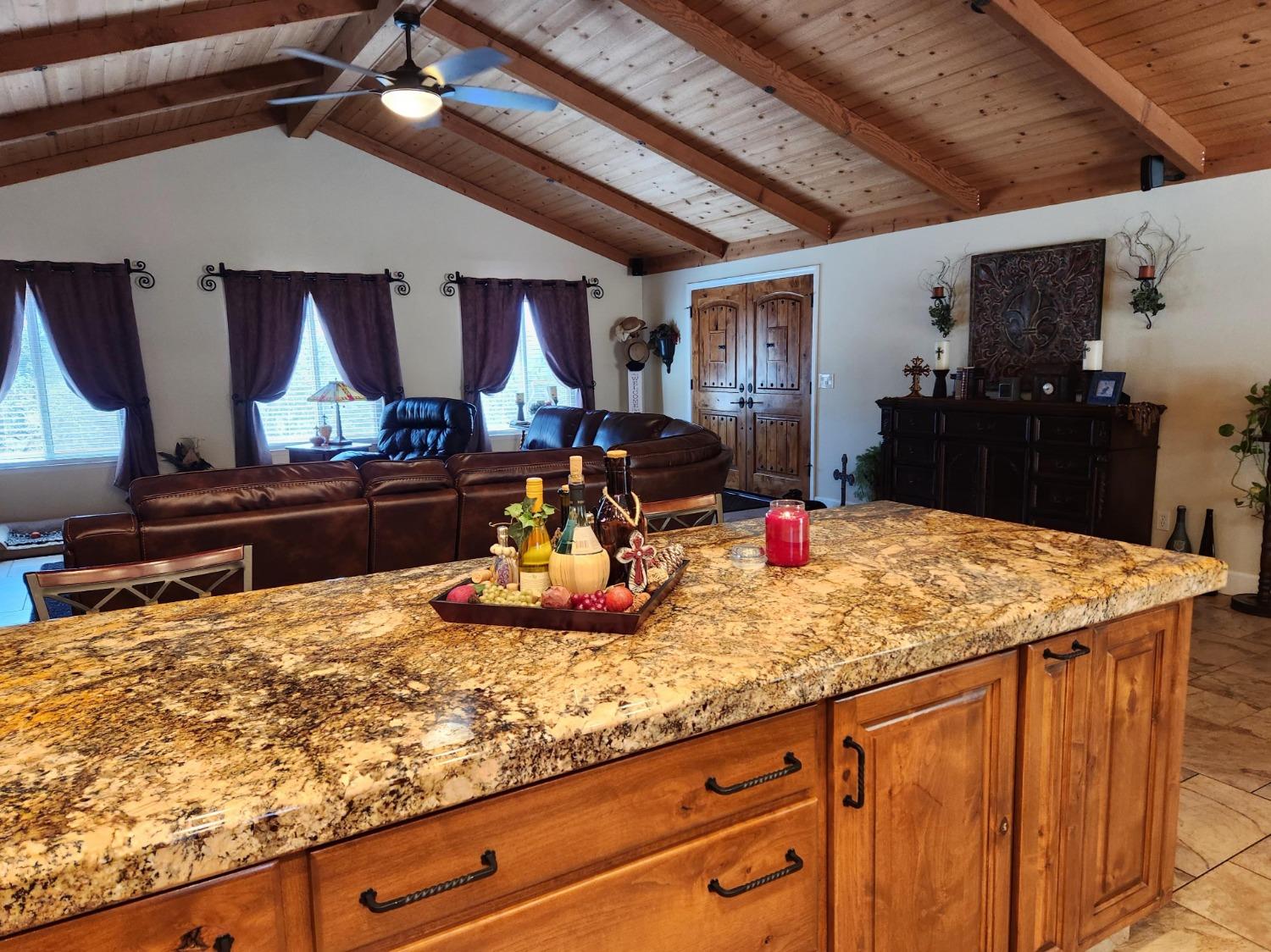 28903 Limestone Circle Coarsegold, CA 93614 - Photo 16 of 59 a kitchen with sink and wooden cabinets