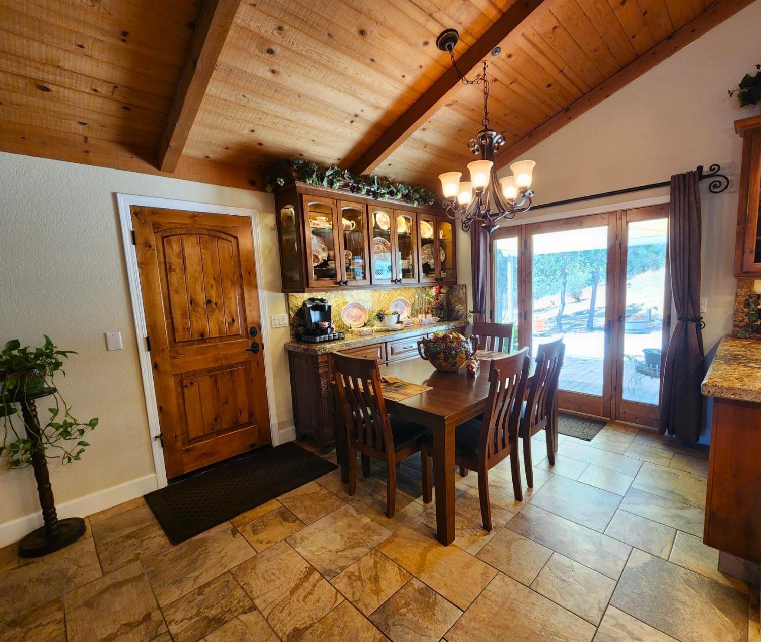 28903 Limestone Circle Coarsegold, CA 93614 - Photo 19 of 59 a view of a dining room with furniture window and outside view