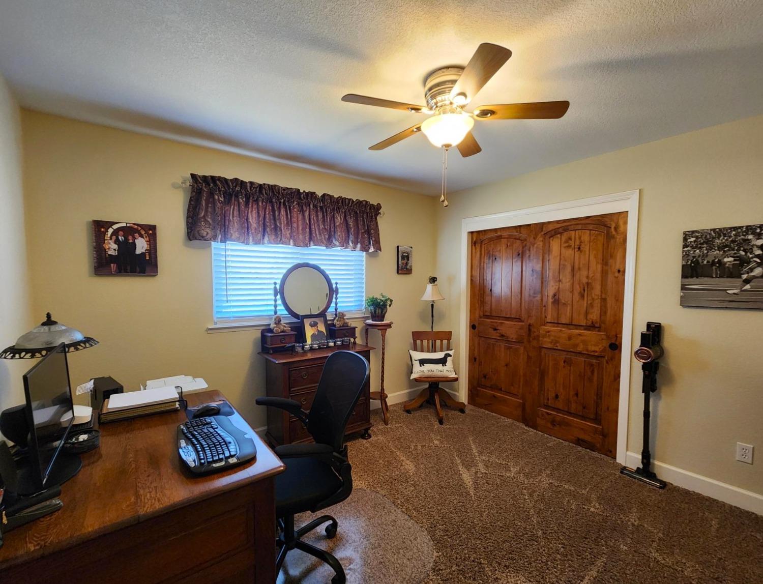 28903 Limestone Circle Coarsegold, CA 93614 - Photo 22 of 59 a view of a workspace with furniture and a fan