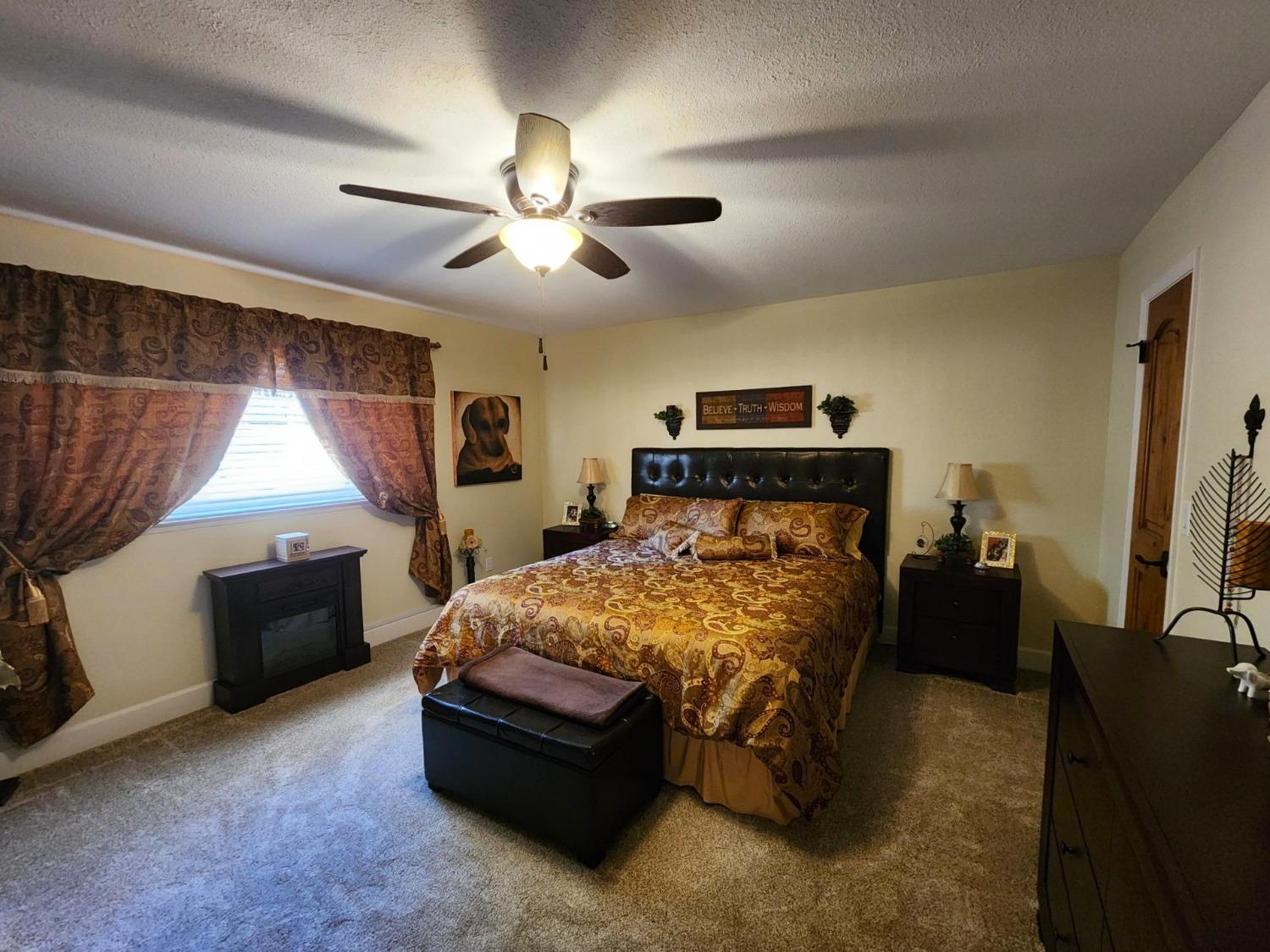 28903 Limestone Circle Coarsegold, CA 93614 - Photo 25 of 59 a bed room with a bed and a window
