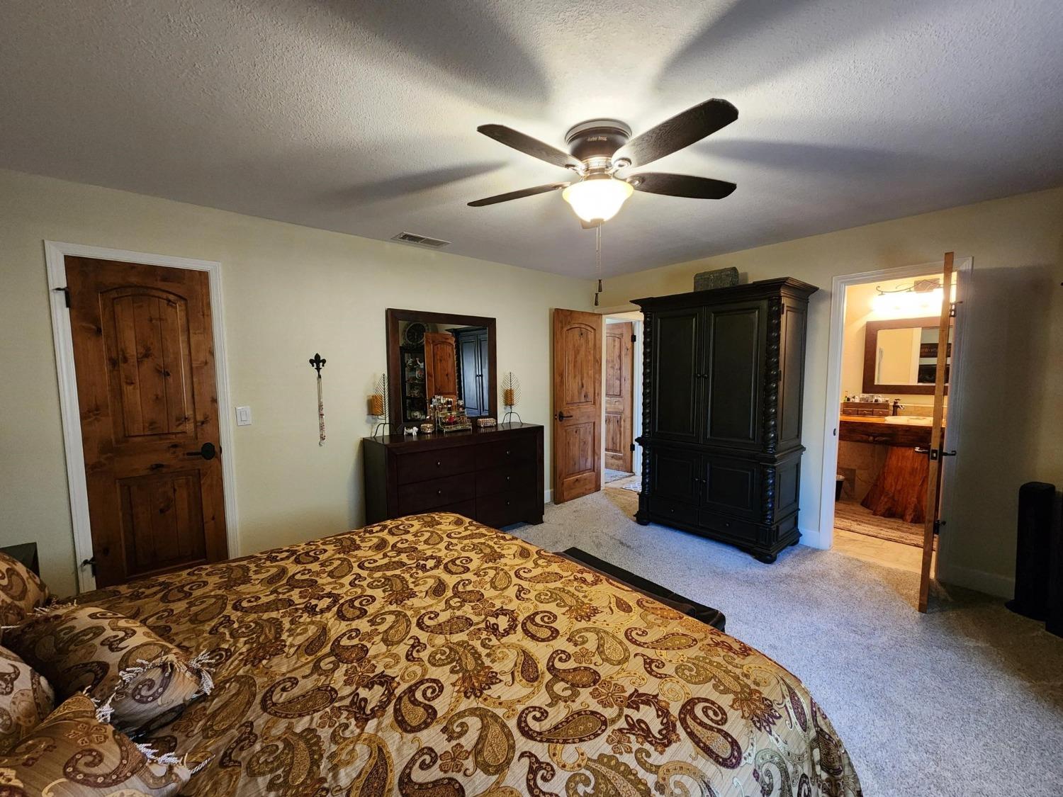 28903 Limestone Circle Coarsegold, CA 93614 - Photo 26 of 59 a bed room with a bed and a television