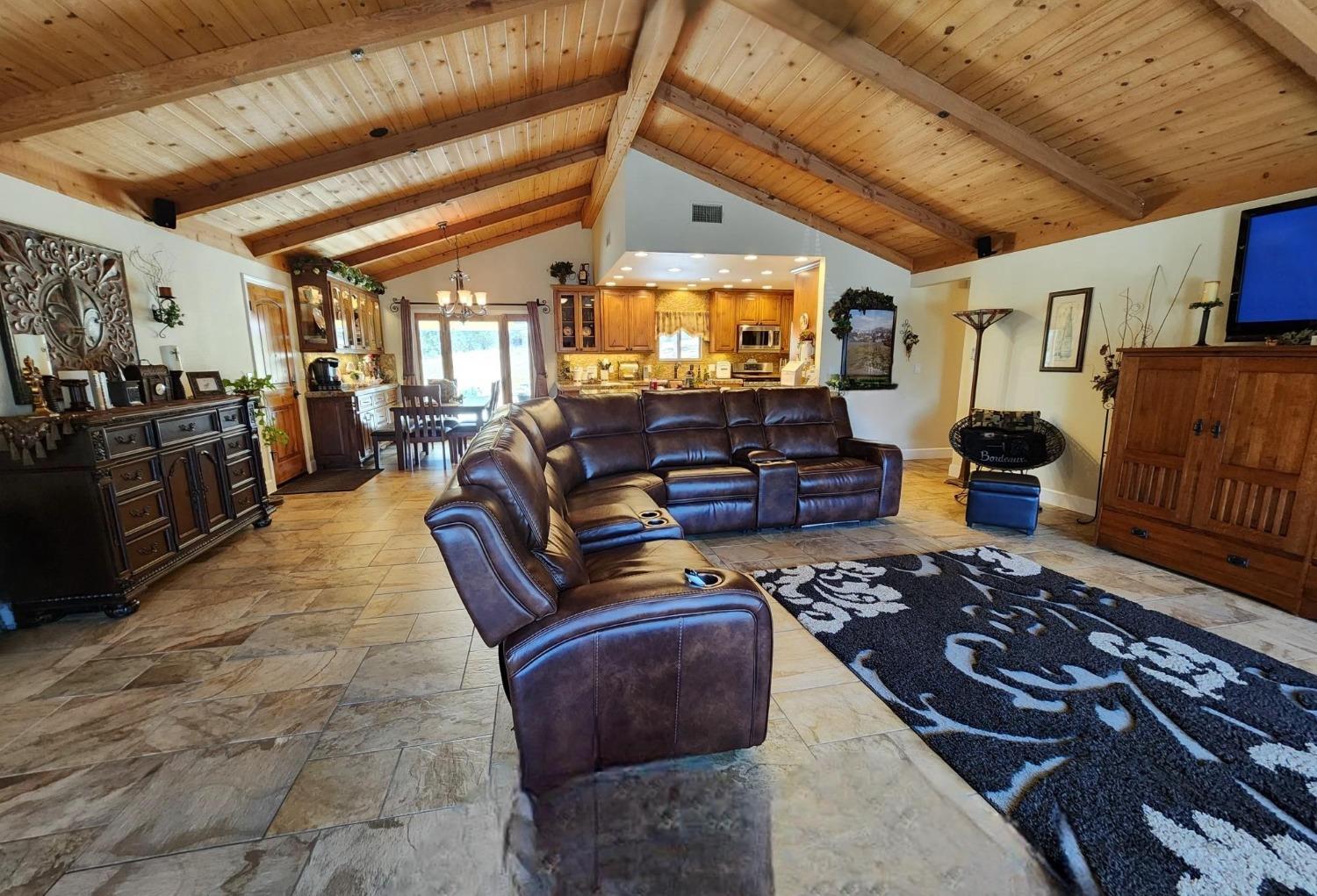 28903 Limestone Circle Coarsegold, CA 93614 - Photo 5 of 59 a living room with furniture and a flat screen tv