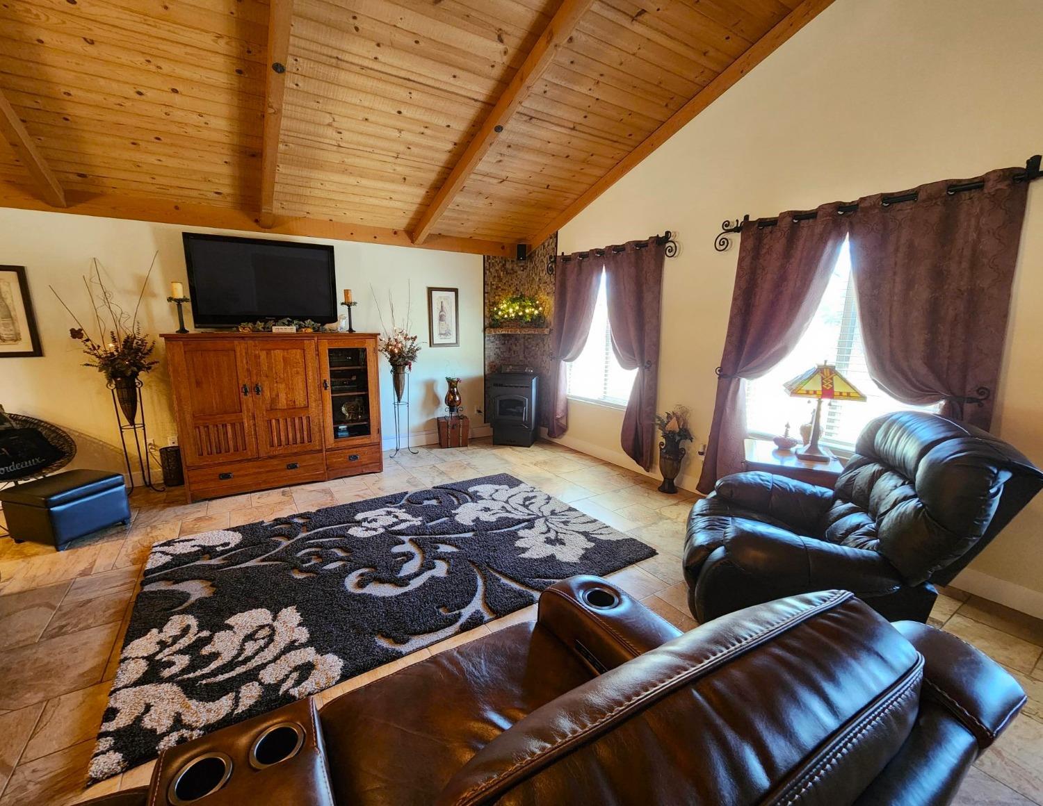 28903 Limestone Circle Coarsegold, CA 93614 - Photo 7 of 59 a bedroom with furniture and a flat screen tv