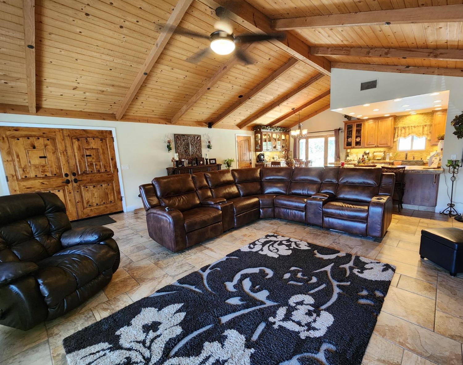 28903 Limestone Circle Coarsegold, CA 93614 - Photo 8 of 59 a living room with furniture and a flat screen tv