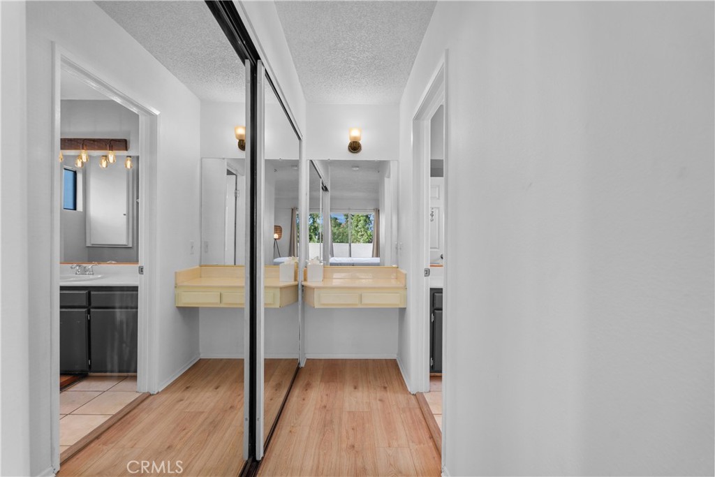 69646 Antonia Way Rancho Mirage, CA 92270 - Photo 42 of 50 a view of a hallway view with wooden floor and staircase