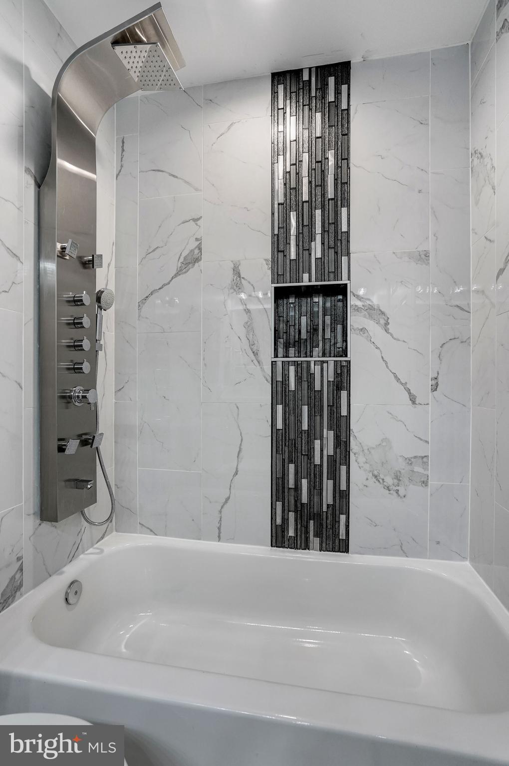 1437 E Street Northeast Washington, DC 20002 - Photo 20 of 39 a bathroom with a bathtub and shower