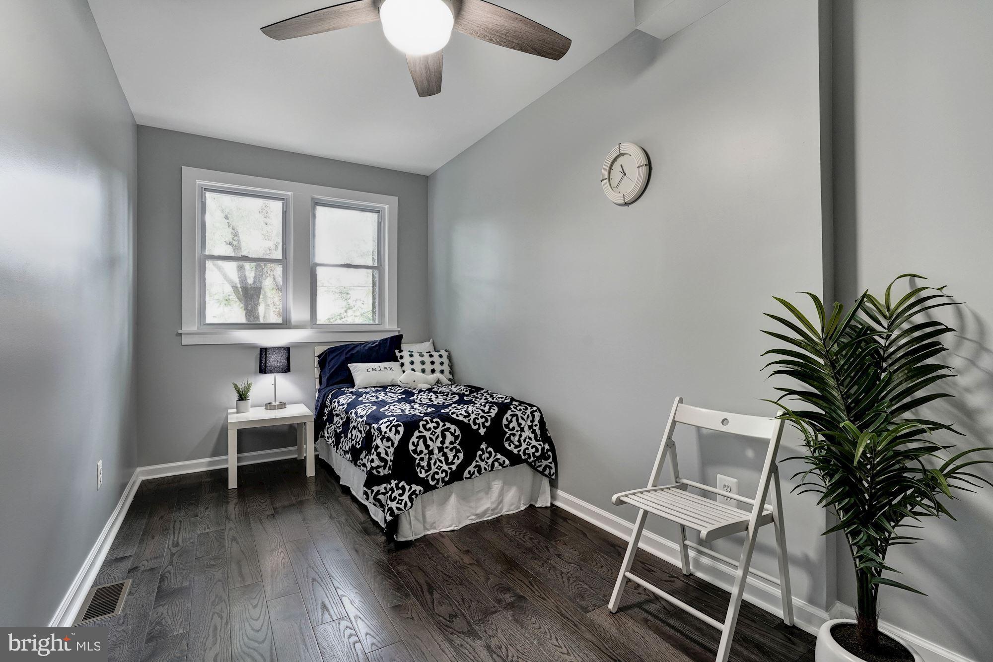 1437 E Street Northeast Washington, DC 20002 - Photo 24 of 39 a bedroom with a bed and a window