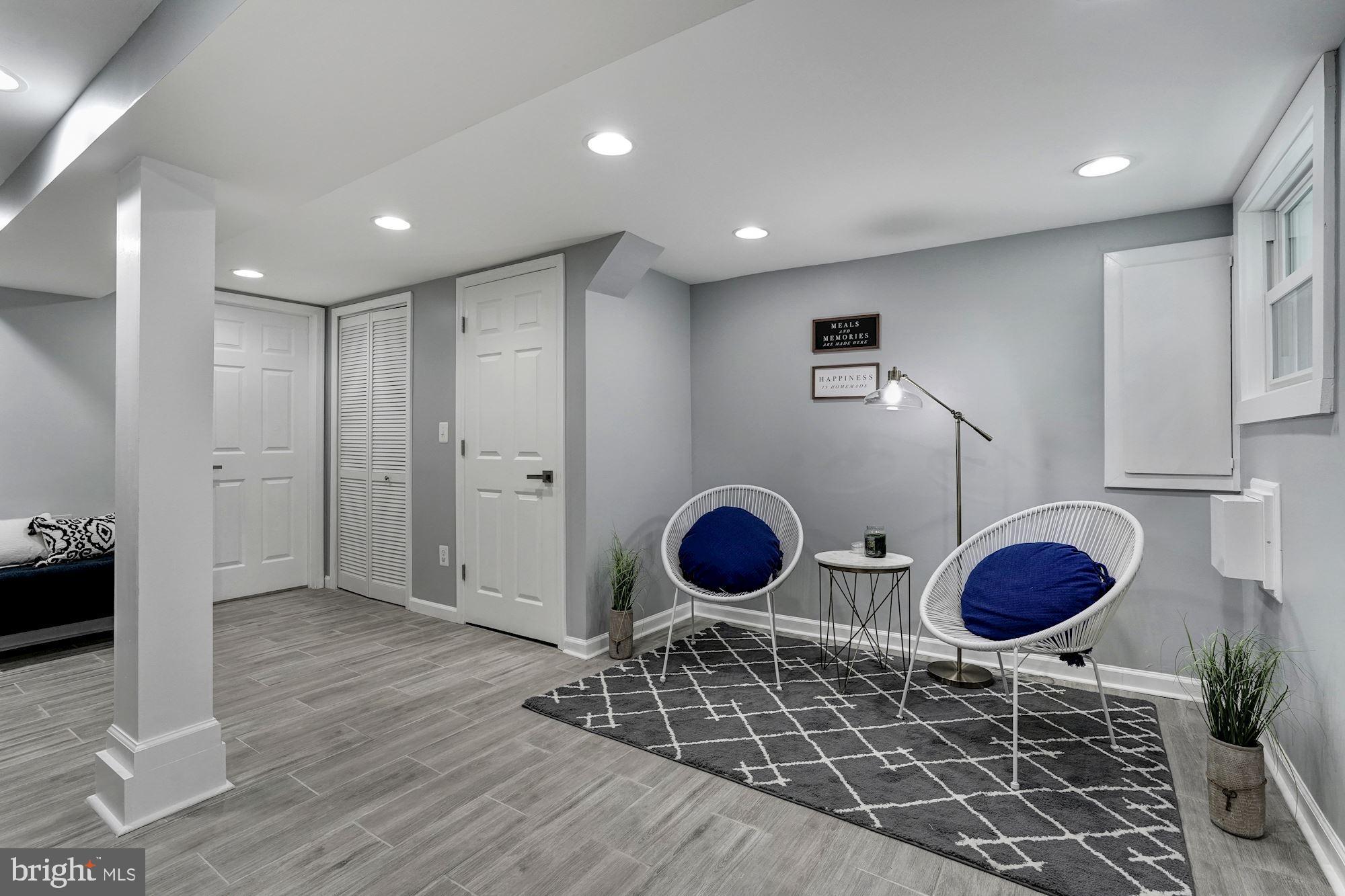 1437 E Street Northeast Washington, DC 20002 - Photo 27 of 39 a kitchen with stainless steel appliances granite countertop a stove a refrigerator and a wooden cabinets