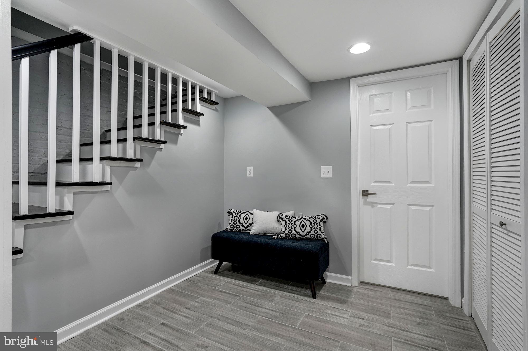 1437 E Street Northeast Washington, DC 20002 - Photo 29 of 39 a living room with furniture and wooden floor