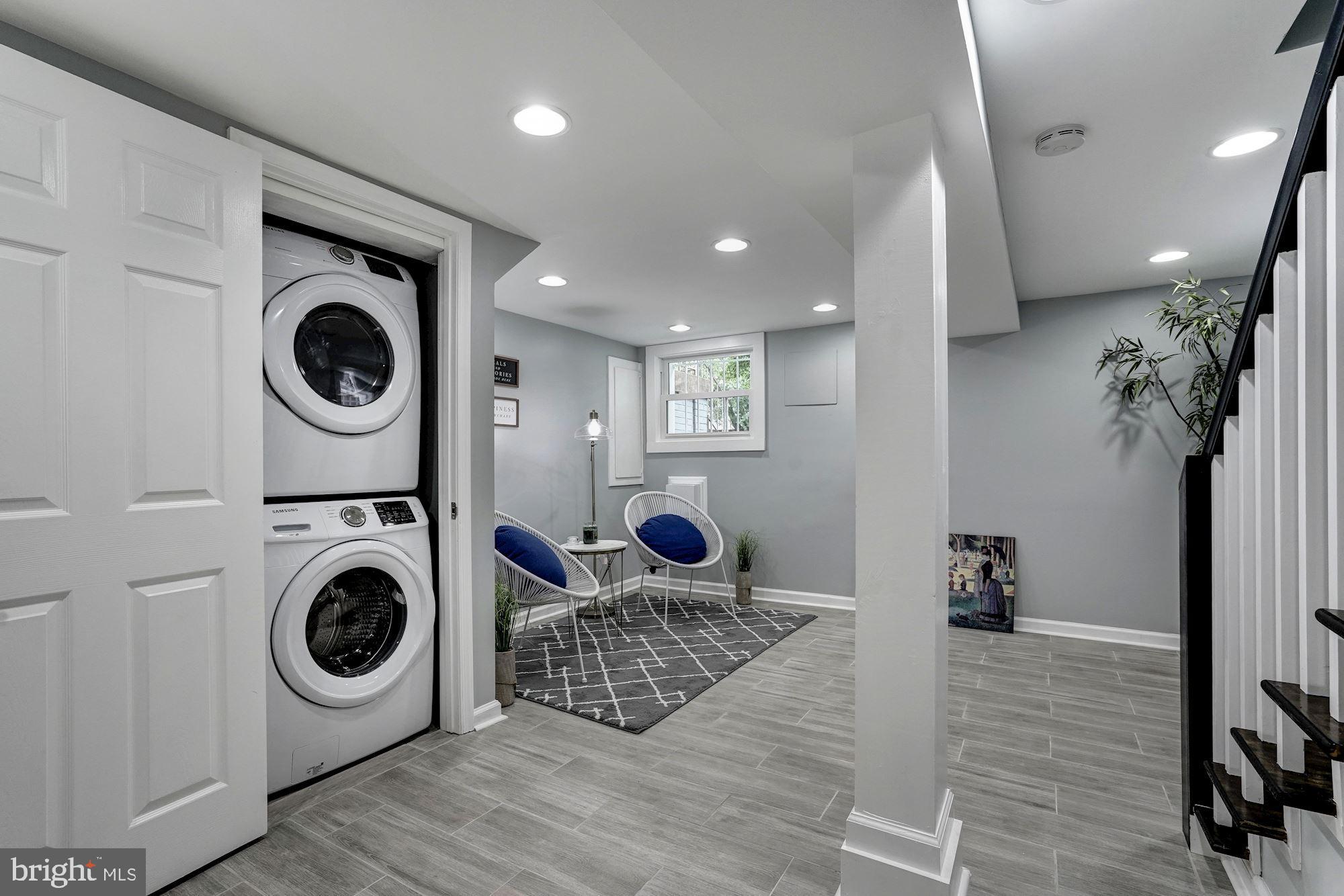 1437 E Street Northeast Washington, DC 20002 - Photo 31 of 39 a living room with furniture and a wooden floor