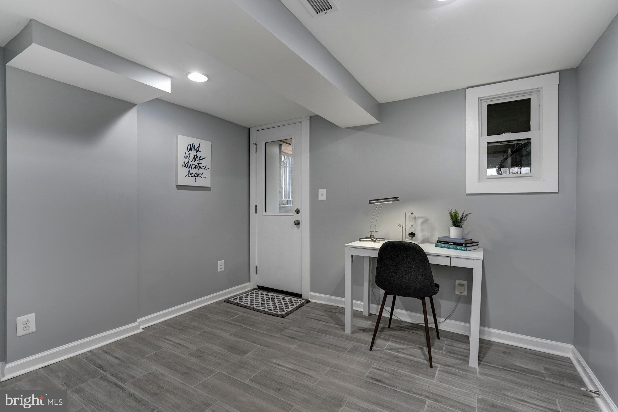 1437 E Street Northeast Washington, DC 20002 - Photo 32 of 39 a workspace room with furniture and wooden floor