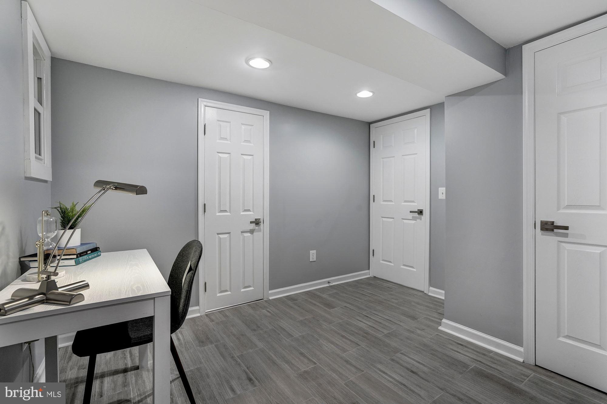 1437 E Street Northeast Washington, DC 20002 - Photo 33 of 39 a view of a workspace with furniture and wooden floor