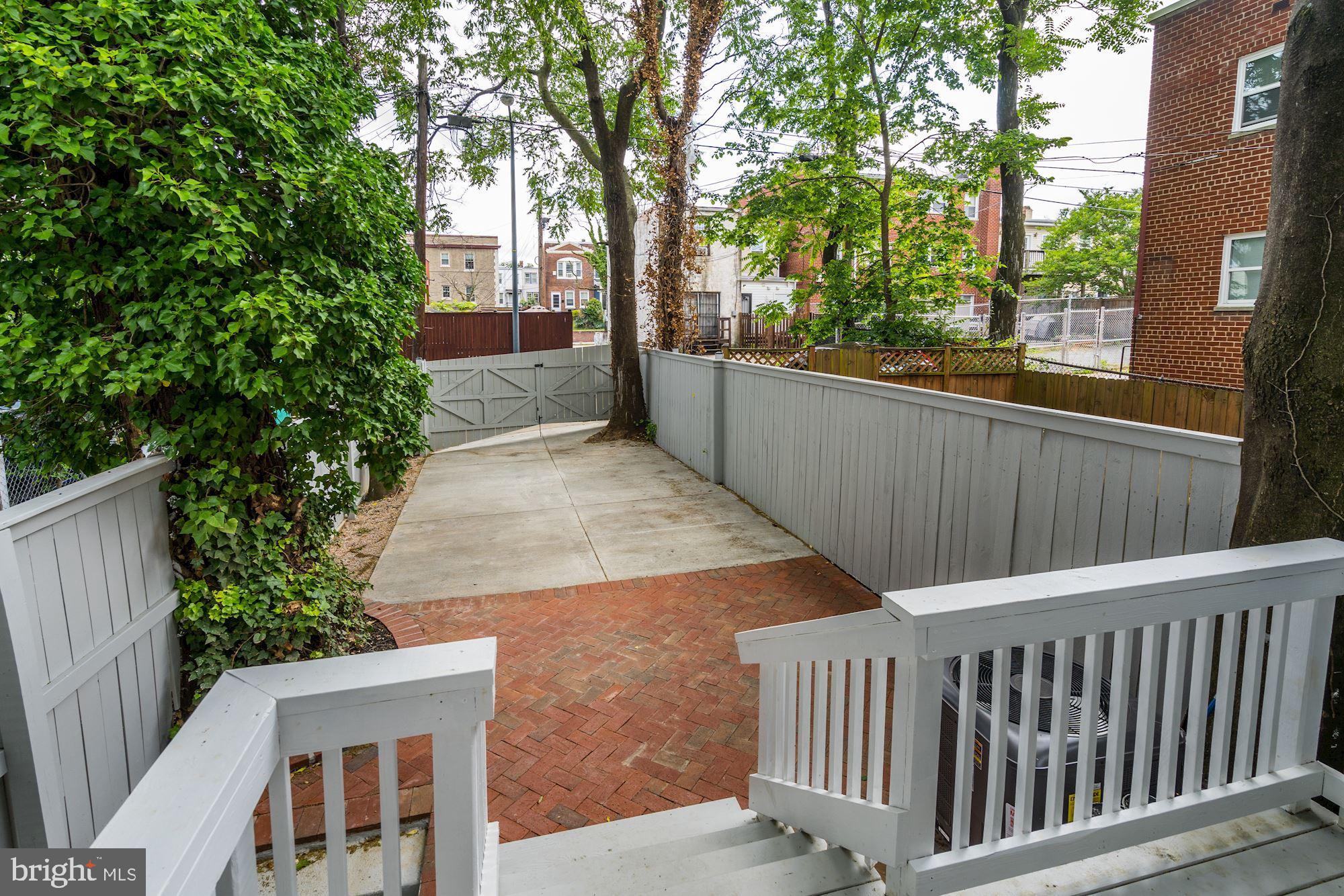 1437 E Street Northeast Washington, DC 20002 - Photo 35 of 39 a view of backyard with deck and trees