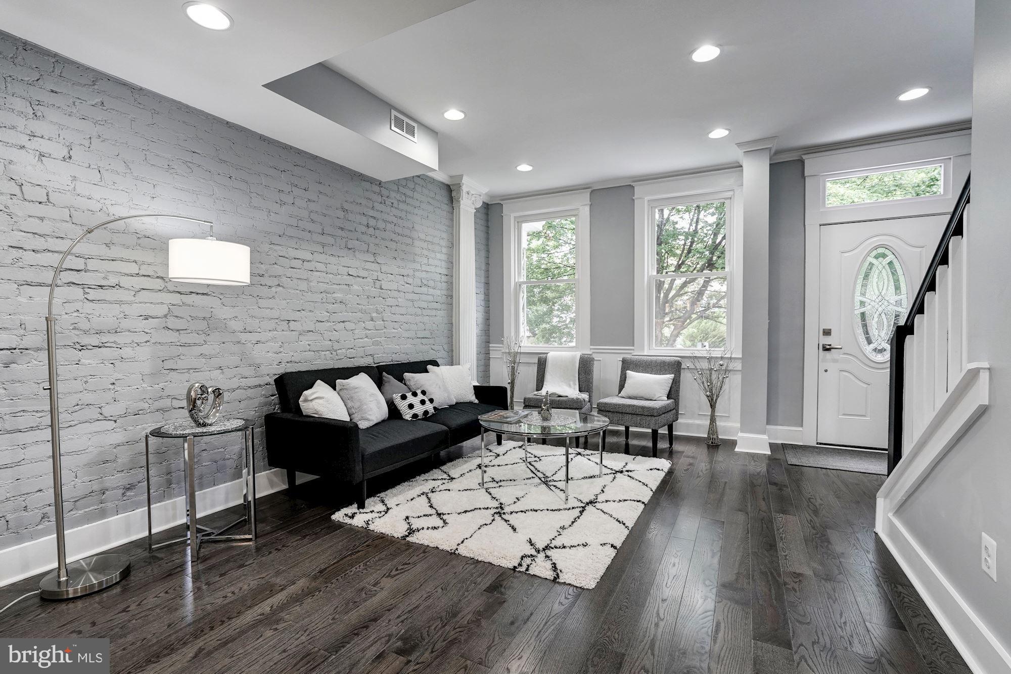 1437 E Street Northeast Washington, DC 20002 - Photo 5 of 39 a living room with furniture and a large window