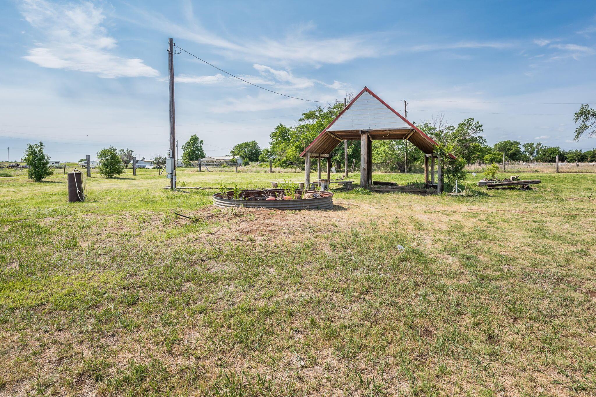 621 Plainview Street Howardwick, TX 79226 - Photo 16 of 18 a view of a house with a yard and sitting area