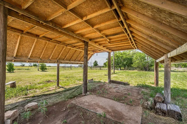 a backyard of a house with a yard and garage