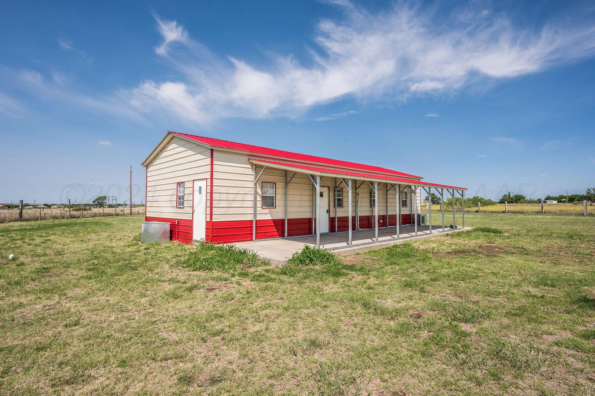 621 Plainview Street Howardwick, TX 79226 - Photo 2 of 18 a view of a big room with floor to ceiling windows