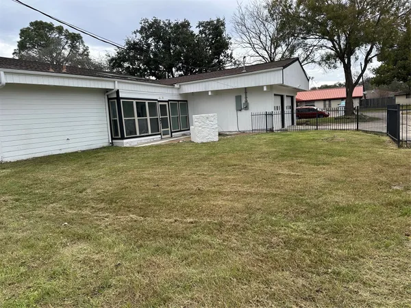 a backyard of a house with oven and outdoor seating
