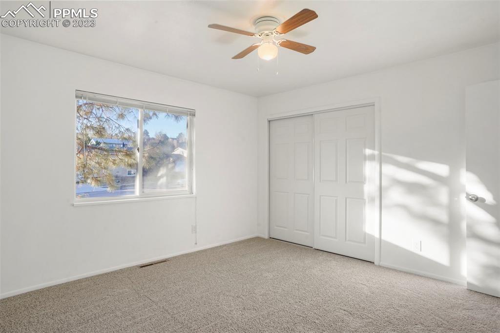 1159 Peterson Road Colorado Springs, CO 80915 - Photo 12 of 22 a view of room with window and ceiling fan