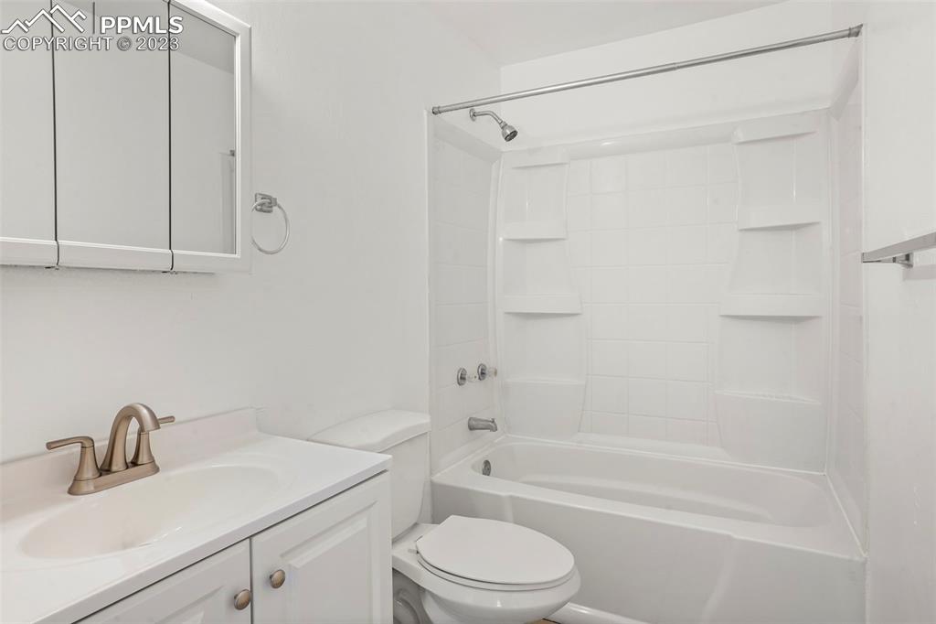 1159 Peterson Road Colorado Springs, CO 80915 - Photo 13 of 22 a bathroom with a sink a toilet and shower