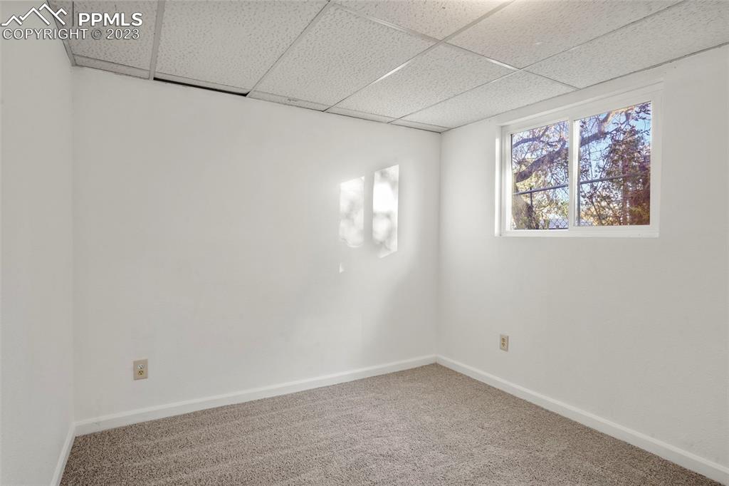 1159 Peterson Road Colorado Springs, CO 80915 - Photo 18 of 22 an empty room with windows