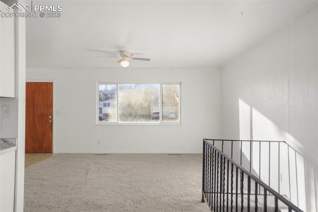 1159 Peterson Road Colorado Springs, CO 80915 - Photo 5 of 22 a view of an empty room with a window