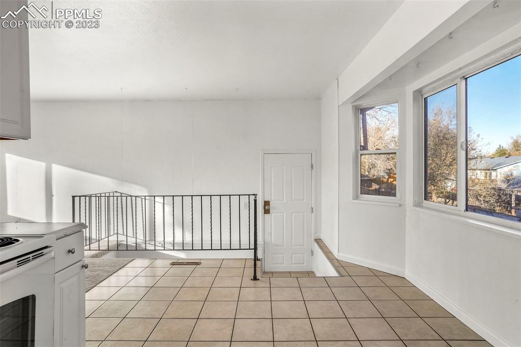 1159 Peterson Road Colorado Springs, CO 80915 - Photo 10 of 22 a view of an empty room with a window