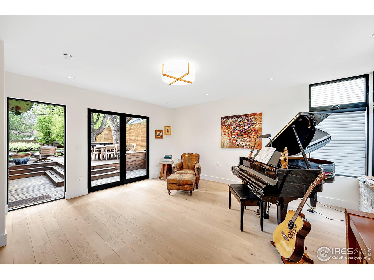 550 Iris Avenue Boulder, CO 80304 - Photo 12 of 40 a bedroom with furniture and a large window
