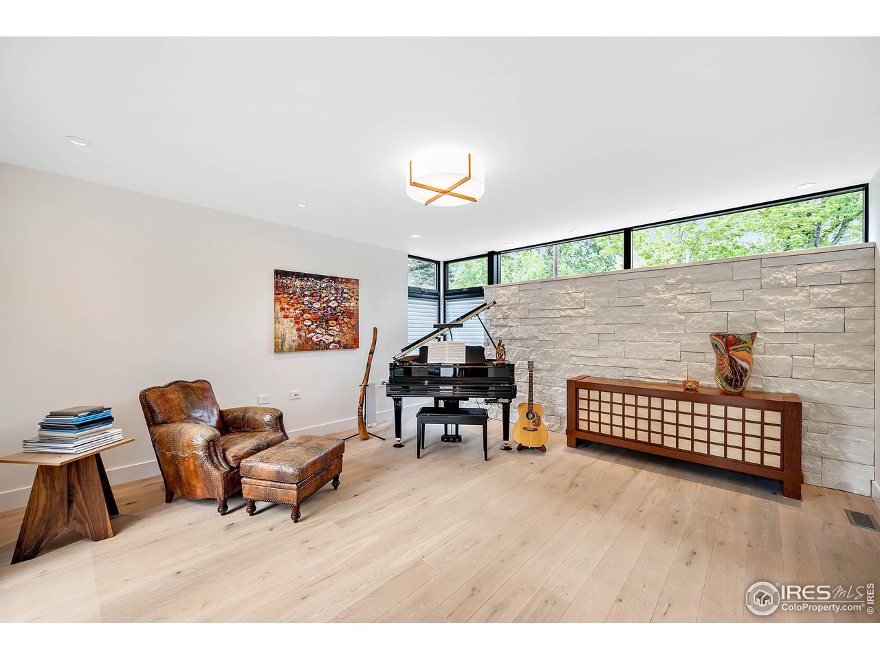 550 Iris Avenue Boulder, CO 80304 - Photo 13 of 40 a living room with furniture and a wooden floor