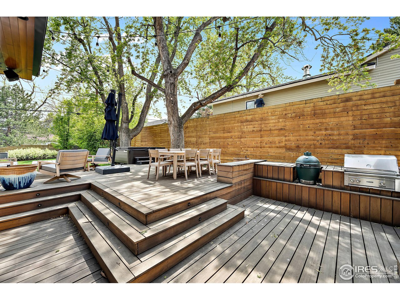 550 Iris Avenue Boulder, CO 80304 - Photo 15 of 40 a view of a balcony with chairs and wooden floor