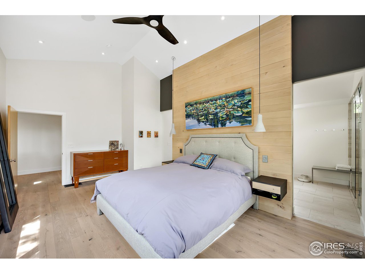 550 Iris Avenue Boulder, CO 80304 - Photo 19 of 40 a bedroom with a bed and a flat screen tv