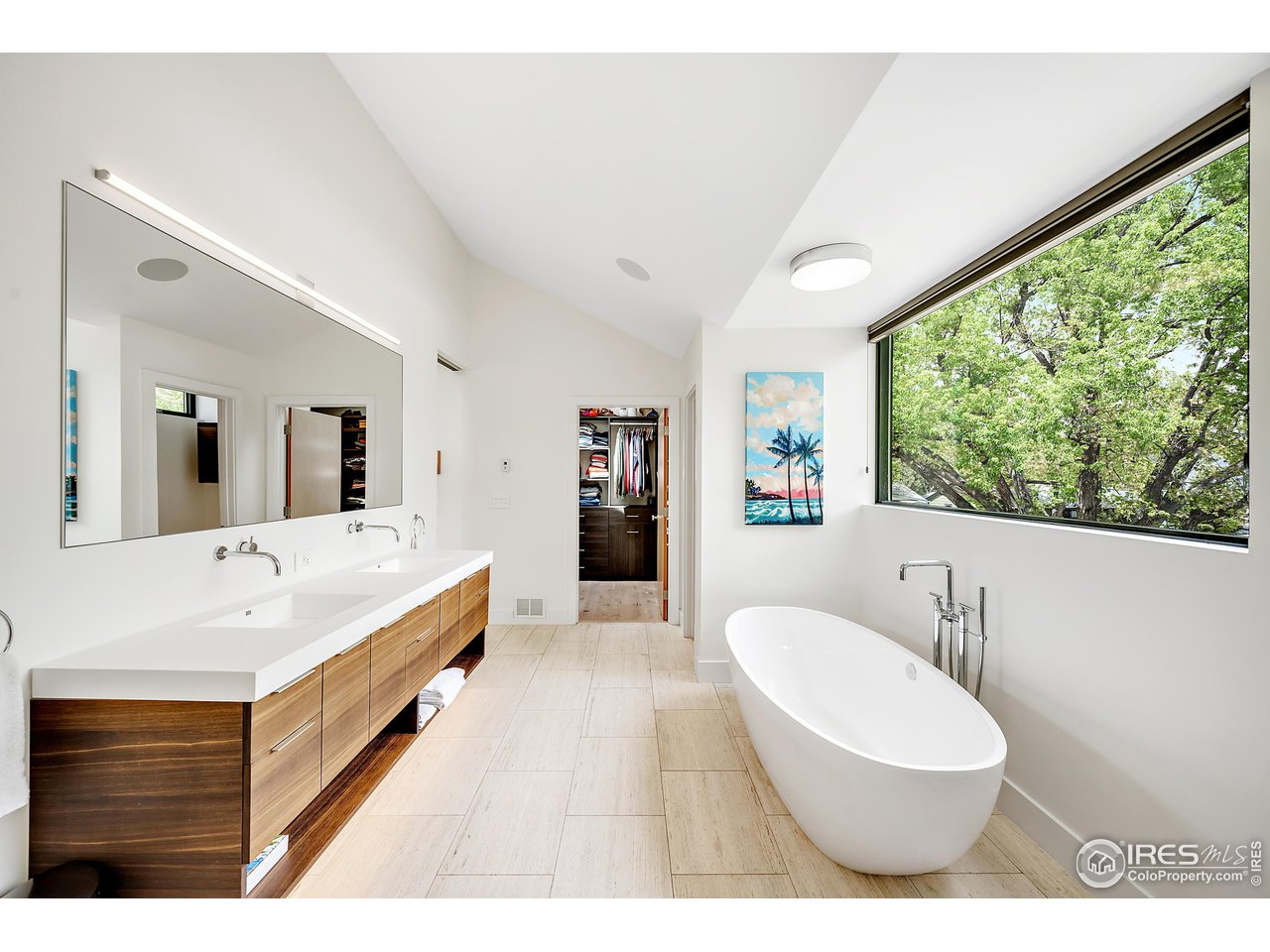 550 Iris Avenue Boulder, CO 80304 - Photo 20 of 40 a spacious bathroom with a double vanity sink a mirror and a bathtub