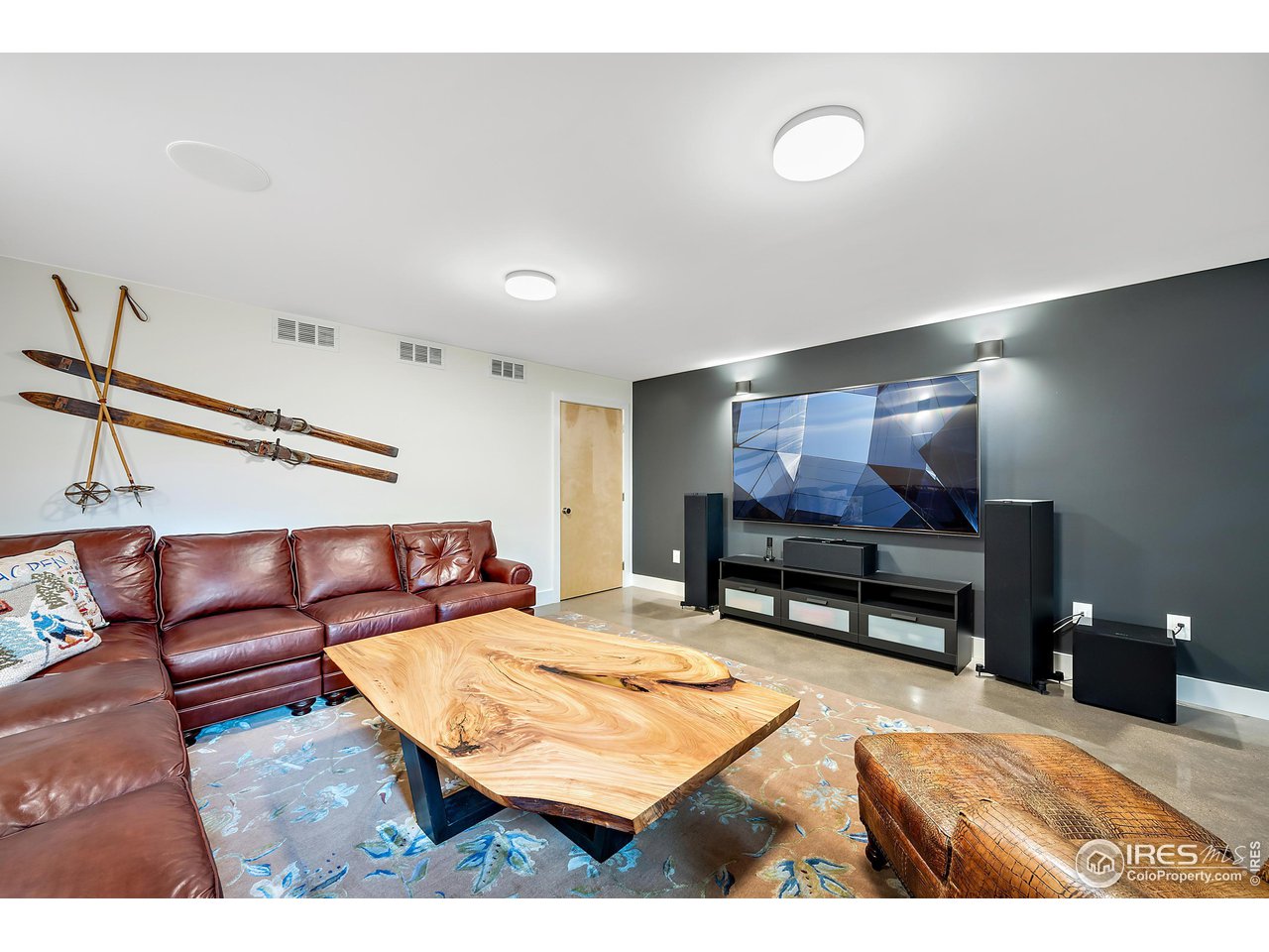 550 Iris Avenue Boulder, CO 80304 - Photo 31 of 40 a living room with furniture and a flat screen tv