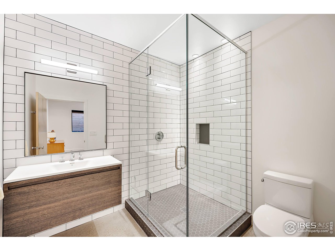 550 Iris Avenue Boulder, CO 80304 - Photo 34 of 40 a bathroom with a sink a toilet and shower