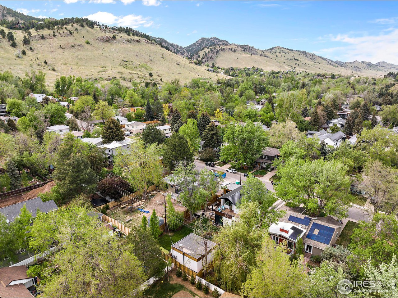 550 Iris Avenue Boulder, CO 80304 - Photo 39 of 40 an aerial view of green landscape with trees houses and mountain view