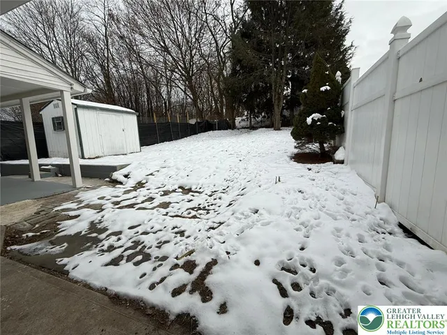 a view of a backyard of snow