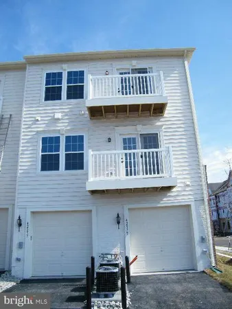 a front view of a house with garage