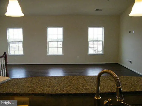 a kitchen with sink and window