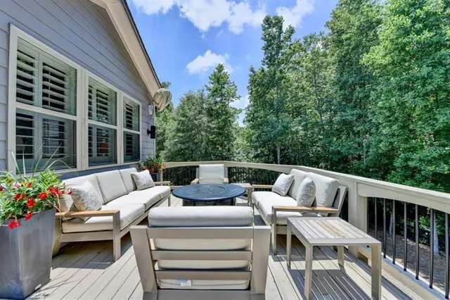 a bathroom with a granite countertop sink a toilet and bathtub