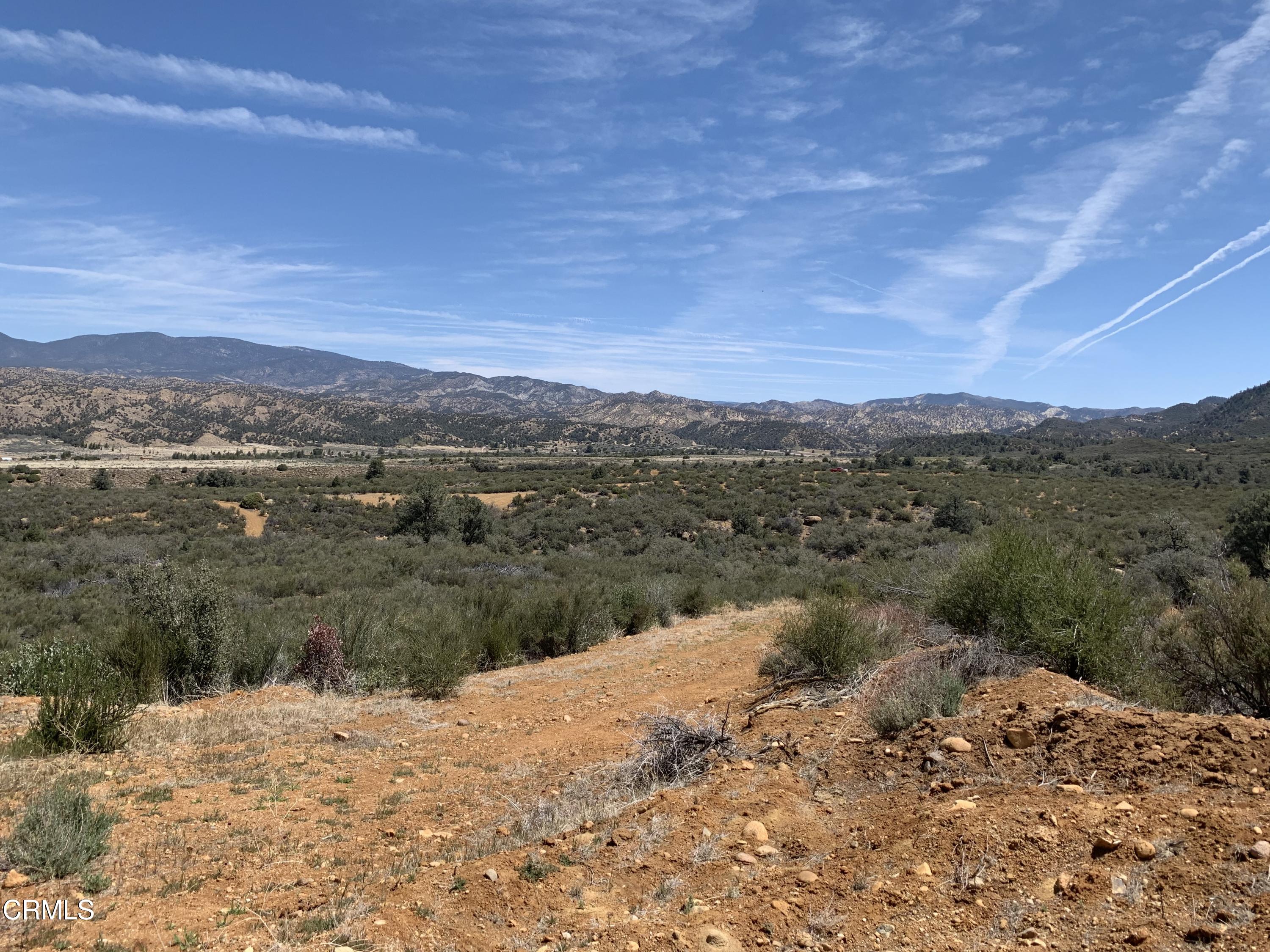 1986 Lockwood Valley Road Frazier Park, CA 93225 - Photo 8 of 22 a view of a dry yard with mountains in the background